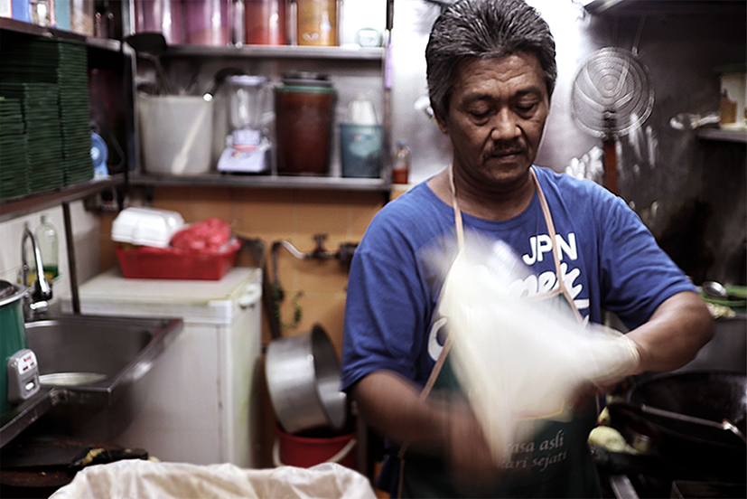 flipping roti prata