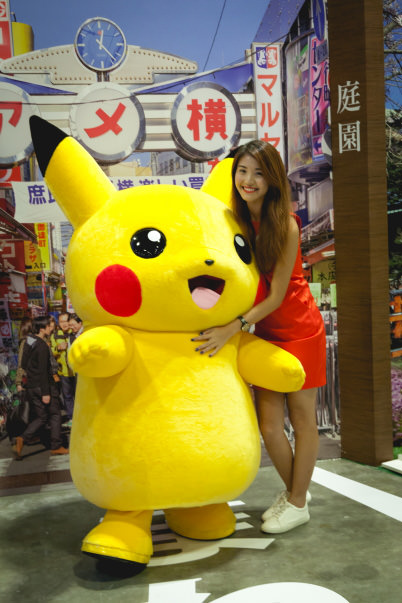 Model with Pikachu at photobooth