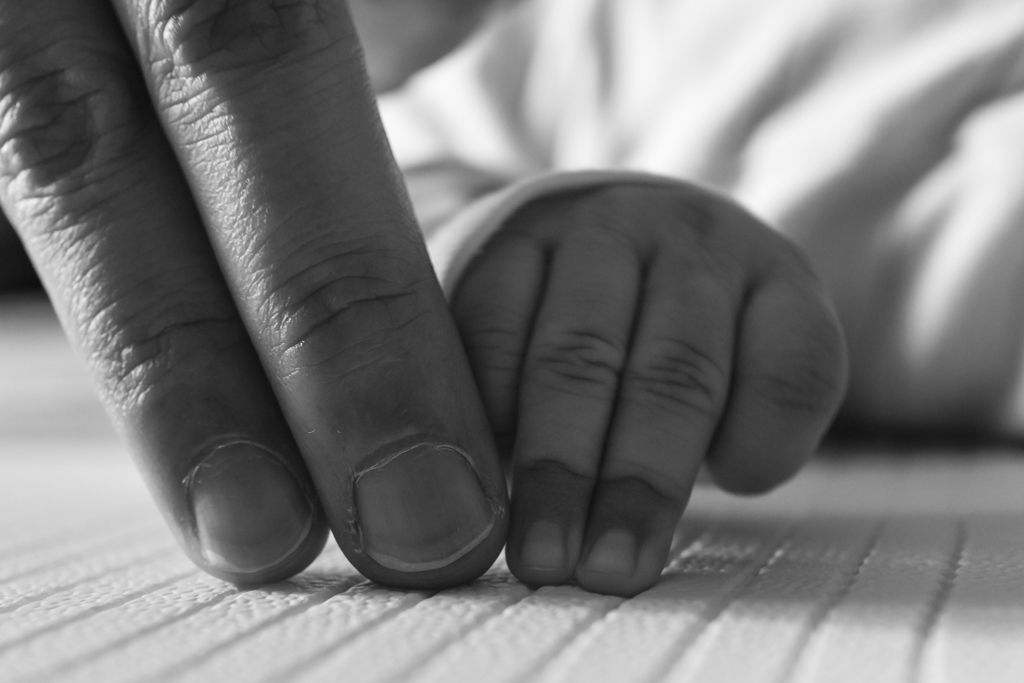 black and white adult and child fingers
