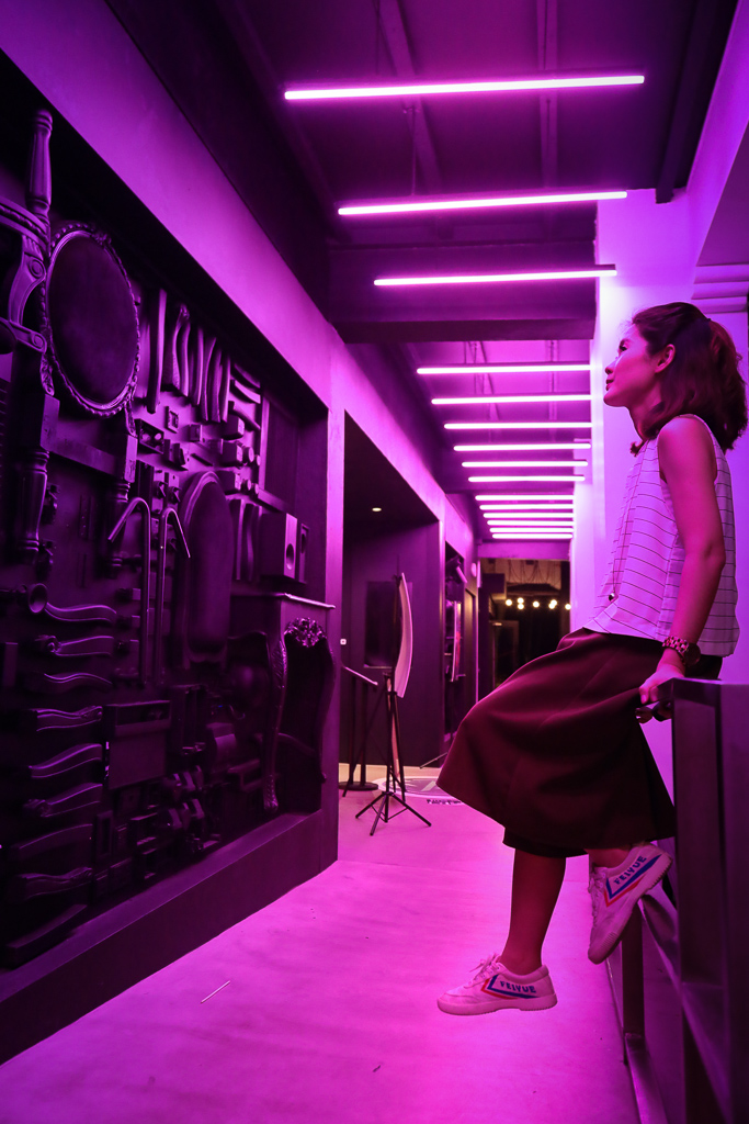 pink lit room with girl