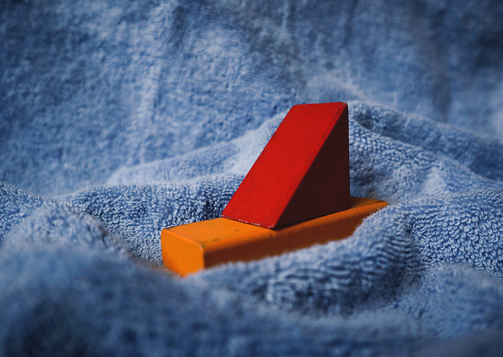 close up of wooden toys on towel