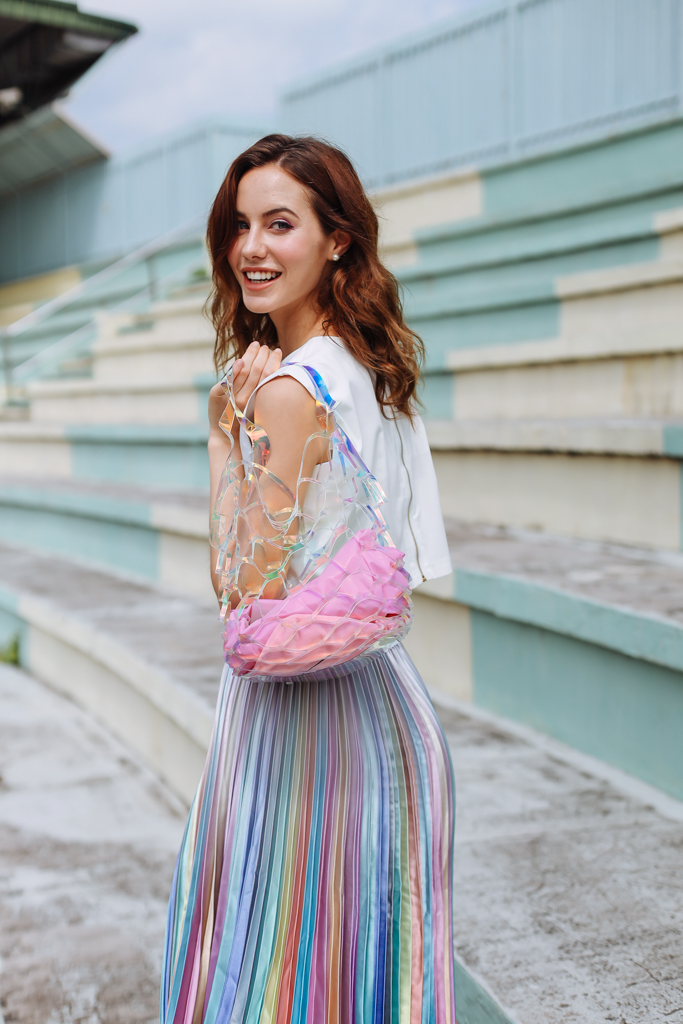 female carrying transparent bag