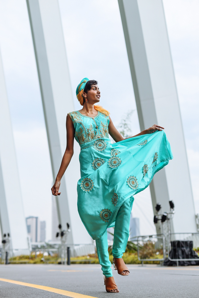 deepavali female model in blue costume dancing