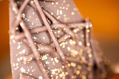 Close-up of chocolate bark and gold flakes