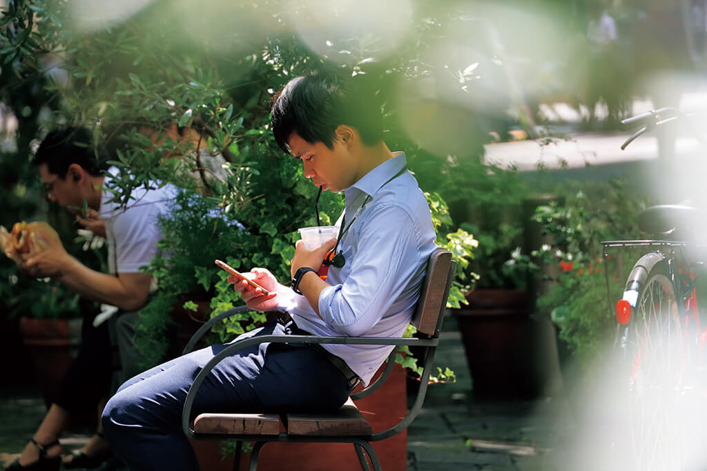 Side view of men sitting on park bench